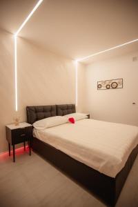 Postel nebo postele na pokoji v ubytování B&B La PerlaNera