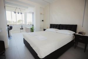 Postel nebo postele na pokoji v ubytování B&B La PerlaNera