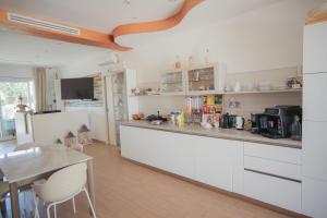 Kuchyň nebo kuchyňský kout v ubytování B&B La PerlaNera + 37 fotografií