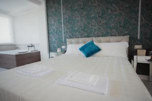 Postel nebo postele na pokoji v ubytování B&B La PerlaNera