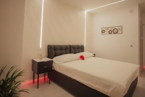 Postel nebo postele na pokoji v ubytování B&B La PerlaNera