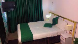 Postel nebo postele na pokoji v ubytování Autograph Apartment