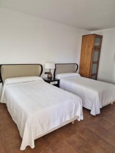 Ein Bett oder Betten in einem Zimmer der Unterkunft Hotel Restaurante Setos