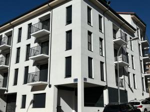 a white building with balconies on the side of it at Vivienda turística El Caminante con garaje in Soria