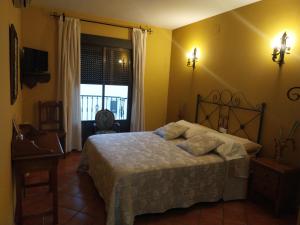 A bed or beds in a room at La Garzona