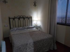 A bed or beds in a room at La Garzona