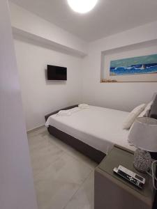 TV a/nebo společenská místnost v ubytování Filocsenia sea side