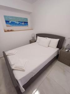 Postel nebo postele na pokoji v ubytování Filocsenia sea side