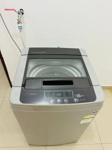 a printer with a cord plugged into a wall at Spacious Semi-D Taman Terus Homestay in Bintulu