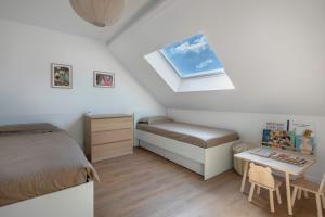 Ένα ή περισσότερα κρεβάτια σε δωμάτιο στο Appartement pour 5 - Proche marche et commerces