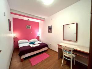 Postel nebo postele na pokoji v ubytování Apartment Bogomir