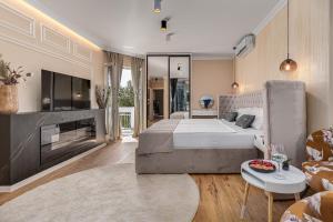 a bedroom with a large bed and a living room at Villa Lea ZadarVillas in Zaton +42 photos