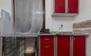 Kuchyň nebo kuchyňský kout v ubytování Apartments Duro