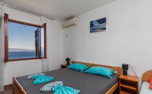 Postel nebo postele na pokoji v ubytování Apartments Duro