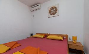 Postel nebo postele na pokoji v ubytování Apartments Duro
