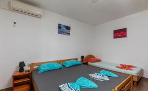 Postel nebo postele na pokoji v ubytování Apartments Duro