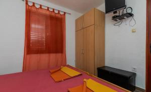 Postel nebo postele na pokoji v ubytování Apartments Duro