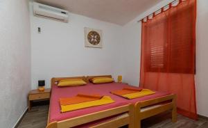 Postel nebo postele na pokoji v ubytování Apartments Duro