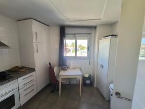 A kitchen or kitchenette at Marenia, dúplex en primera línea de playa