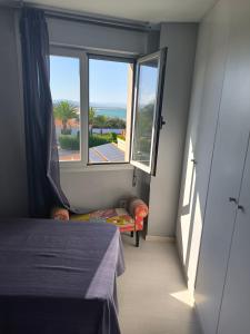 A bed or beds in a room at Marenia, dúplex en primera línea de playa