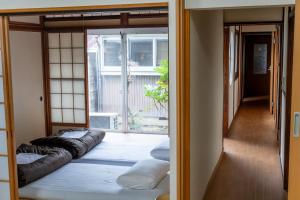Voodi või voodid majutusasutuse 永楽町House toas