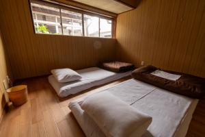 Voodi või voodid majutusasutuse 永楽町House toas