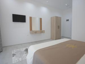 Postel nebo postele na pokoji v ubytování Shatri Hotel