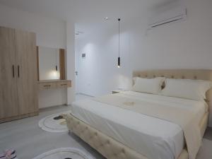 Postel nebo postele na pokoji v ubytování Shatri Hotel