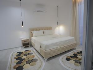 Postel nebo postele na pokoji v ubytování Shatri Hotel