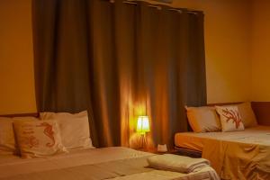 Postel nebo postele na pokoji v ubytování Coral Beach + 14 fotografií