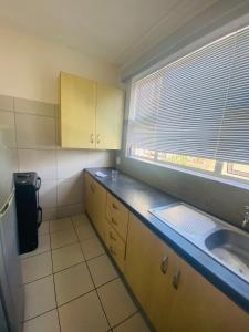 Dapur atau dapur kecil di Cosy Apartment