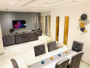 TV a/nebo společenská místnost v ubytování IRIS Home
