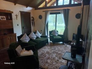 Posezení v ubytování Cabaña en parcela con Tinaja - Puertas del Bosque + 9 fotografií