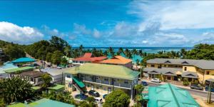 an aerial view of a town with the ocean at Royale Self Catering Apartments in Anse Royale