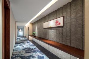 Postel nebo postele na pokoji v ubytování Glean Hotel Xinzhou