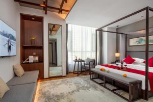 Postel nebo postele na pokoji v ubytování Glean Hotel Xinzhou