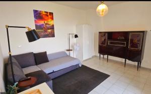 a living room with a couch and a tv at Letto del Monte guest house in Lettomanoppello