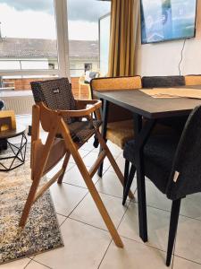 TV a/nebo společenská místnost v ubytování Apartment Krautinsel mit Seeblick
