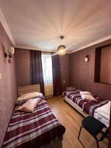 A bed or beds in a room at Guest house chavchavadze N23