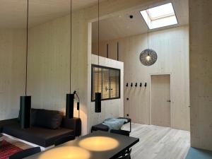 Letto o letti in una camera di Bio Design Appartements DAS GRAUE SCHAF - Kärnten Card im Sommer inklusive