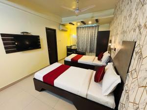 Postel nebo postele na pokoji v ubytování Hotel Chariot Inn Patna