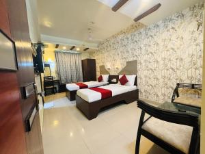 Postel nebo postele na pokoji v ubytování Hotel Chariot Inn Patna