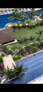 a model of a resort with a pool and palm trees at Studio Units at Shore Residences Condo MOA Complex near Airport in Manila