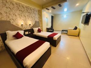 Postel nebo postele na pokoji v ubytování Hotel Chariot Inn Patna