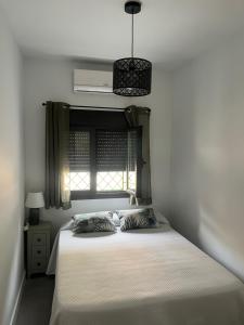 Giường trong phòng chung tại Luis Montoto