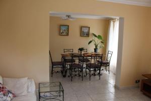 a dining room with a table and chairs at Maison individuelle in Ossun
