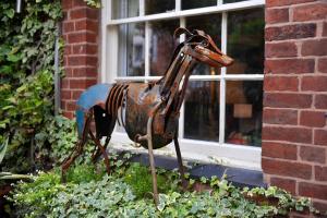 a statue of a horse in front of a building at The Greyhound Coaching Inn in Lutterworth +13 photos