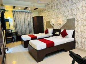 Postel nebo postele na pokoji v ubytování Hotel Chariot Inn Patna + 37 fotografií