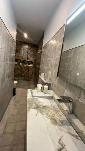 a bathroom with two sinks and a large mirror at Boutique Hotel Las Islas in Fuengirola +114 photos