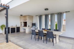 TV a/nebo společenská místnost v ubytování Villa Terra Grigia